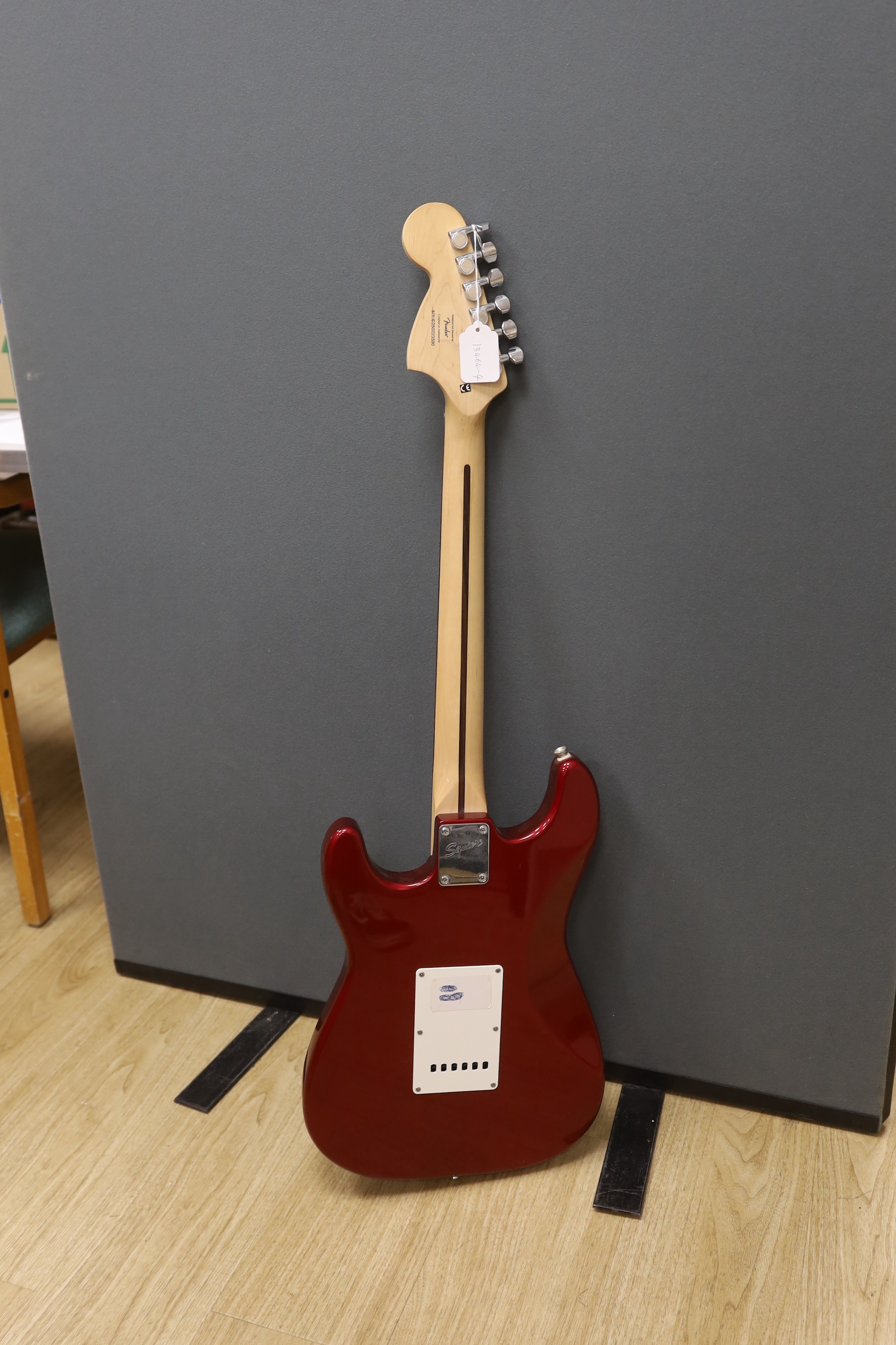 A Fender Squier Strat electric guitar with a soft case